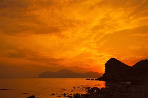 Premium Photo Sunset Over Rocky Coast