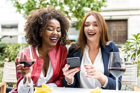 Premium Photo Two Adult Woman Having Fun During Happy Hour After Work