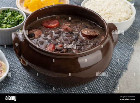 Traditional Brazilian Feijoada With Rice Orange Kale And Pepper Stock