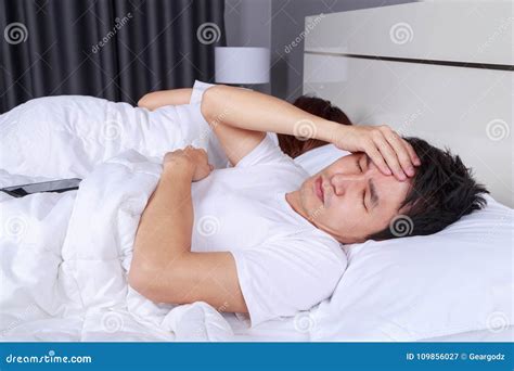 Man Having Sleepless On Bed And Having Migraine Stress Insomnia Stock