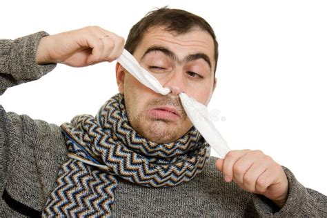 Ill Guy With Runny Nose Using Laptop On The Couch Stock Photo Image