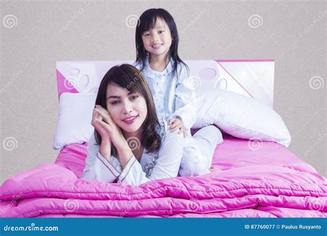 Beautiful Mother Plays With Her Daughter On Bed Stock Image Image Of