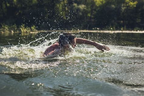 The Young Man Swimming in the River Stock Image - Image of person, recreation: 192050827