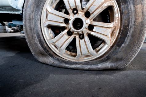 Close Up Of A Damaged Flat Tire Of A Car Stock Photo Image Of Burst