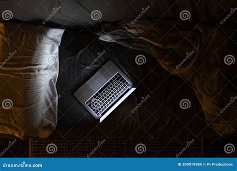 Laptop on the Bed at Night, Light from the Laptop Screen, Top View ...