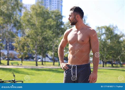 Handsome Sportsman With Naked Torso Resting While Working Out At Sunny