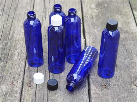 Buy Brand New 1 Oz Empty Plastic Blue Pet Bottles W Black Ribbed Lids