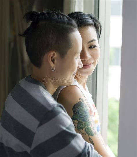 Two Asian Lesbian Looking Together In Bedroom Beauty Concept Stock