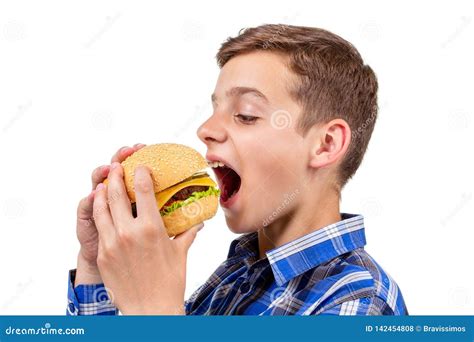 Caucasian Boy Eating Burger And Hamburger On White Background Bun