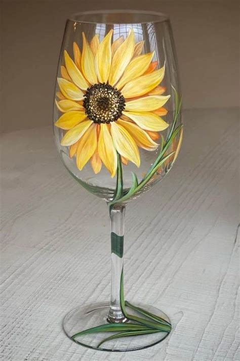 A Sunflower Painted On The Stem Of A Wine Glass