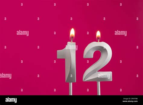 Candle Number 12 Birthday In Rhodamine Red Background Stock Photo Alamy