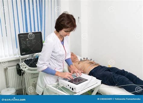 ECG Concept Woman Doctor Cardiologist Doing Electrocardiogram Test To