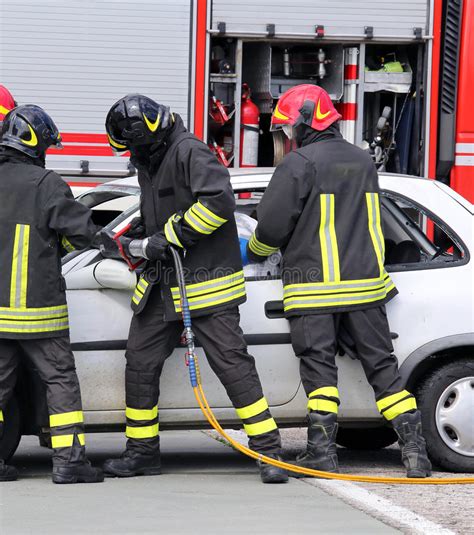 Firefighters Relieve An Injured After Car Accident Stock Image Image