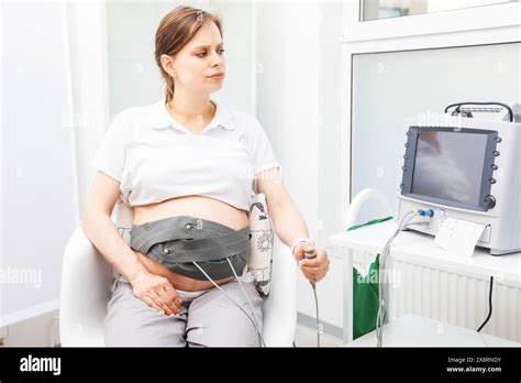 A Pregnant Woman Performing Cardiotocography Ctg To Monitor Fetal