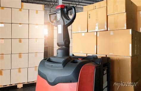 Electric Forklift Pallet Jack With Cargo Shipment Boxes Stack Wall