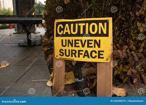 View of Yellow Warning Sign Caution Uneven Surface Stock Image - Image ...