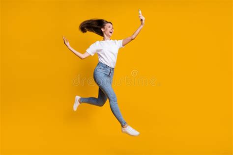 Full Length Body Size Photo Of Cheerful Overjoyed Girl Fan Jumping