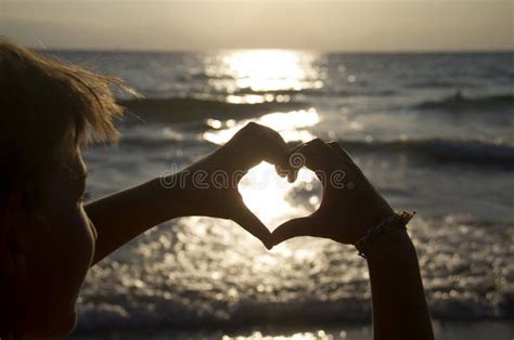 Sunset in heart hands stock photo. Image of recreation - 108940526