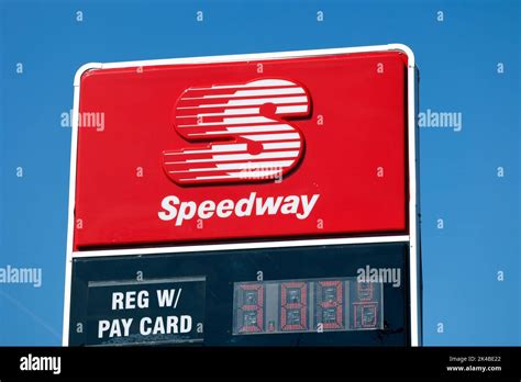 Signage for a Speedway gas station against a sunny blue sky Stock Photo ...