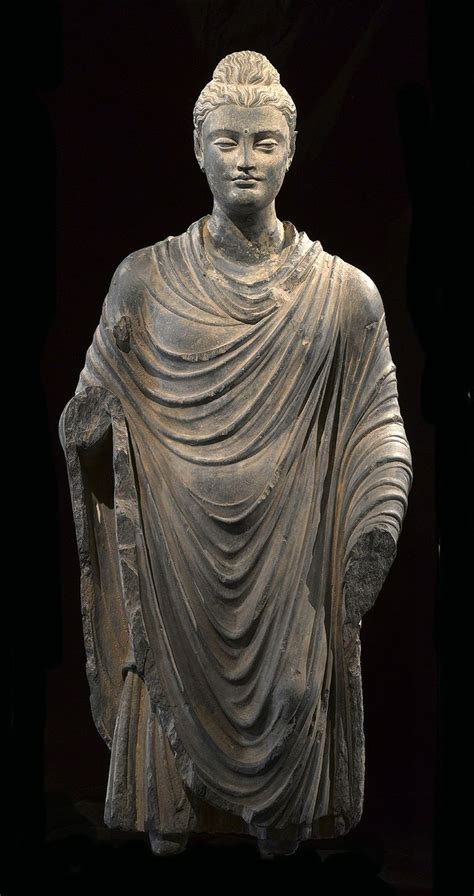 a statue of a man wearing a robe