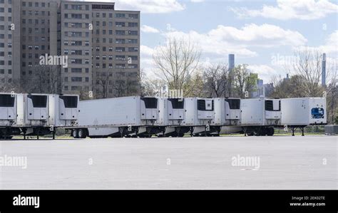 Dozens Of Refrigerated Trucks And Containers Seen On Randalls Island