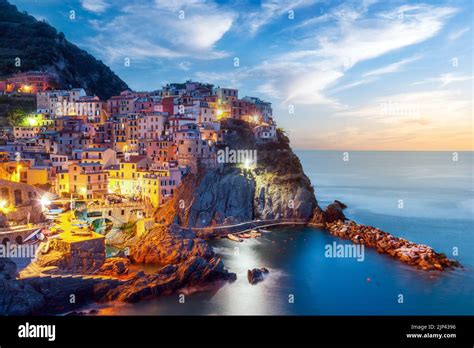 Incredible Morning View Of Manarola City With Costal Rocks On A Foreground Cinque Terre