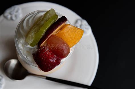 Summertime Dessert Panna Cotta Topped With Exotic Fruits Stock Image