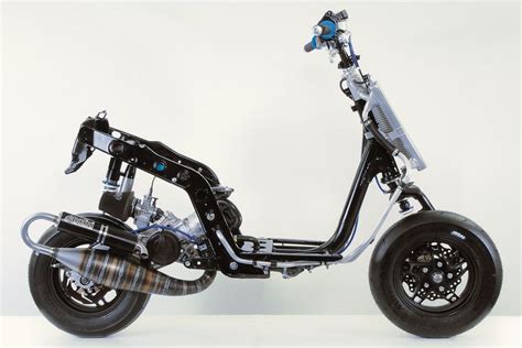 An Electric Scooter Is Shown On A White Background In This Image It