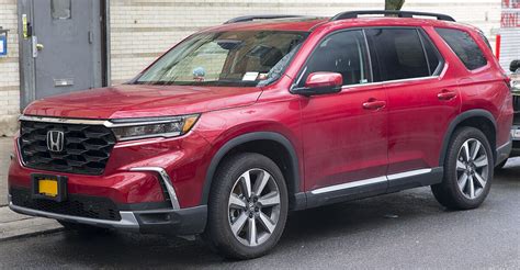 File2023 Honda Pilot Touring In Radiant Red Front Left Cropped