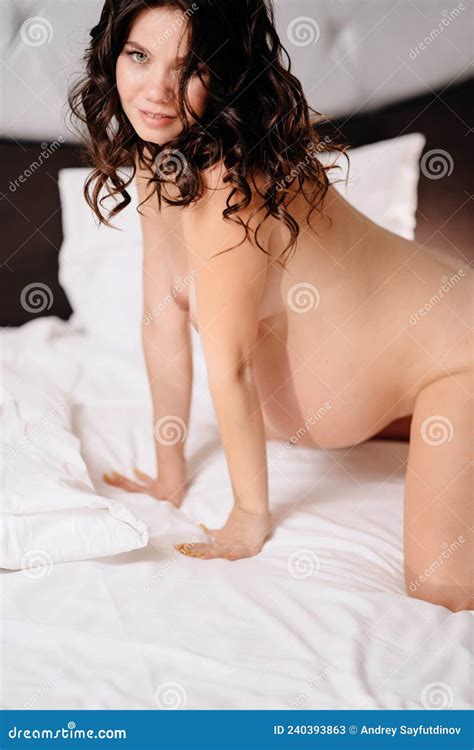 A Naked Pregnant Woman On All Fours In Bed Sex Life During Pregnancy