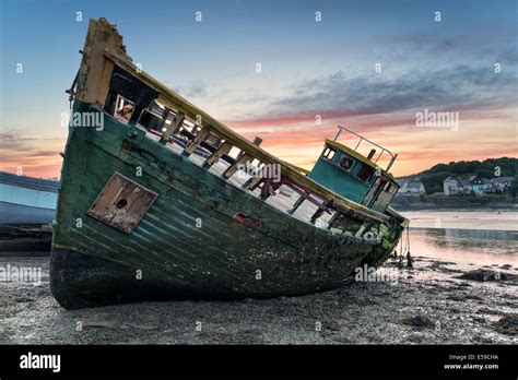 An Old Wrecked Wooden Boat On The Shore Stock Photo Alamy