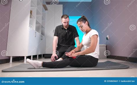 Myofascial Release A Male Physiotherapist Places A Ball For The