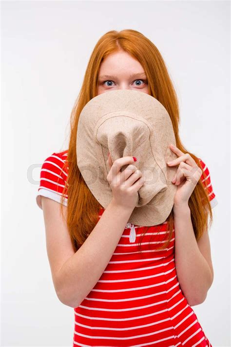 Embarrassed Shy Woman Hiding Her Face Behind Hat Stock Image Colourbox