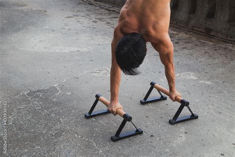 Young Asian Man Is Doing Street Workout Handstand Exercise Bodyweight