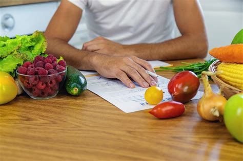 Premium Photo A Nutritionist Writes A Nutrition Plan Selective Focus