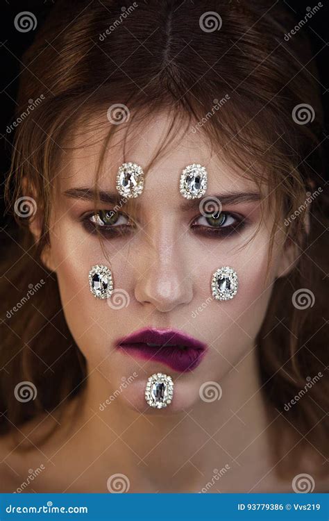 Studio Fashion Portrait Of Attractive Woman With Gemstones On Fe Stock