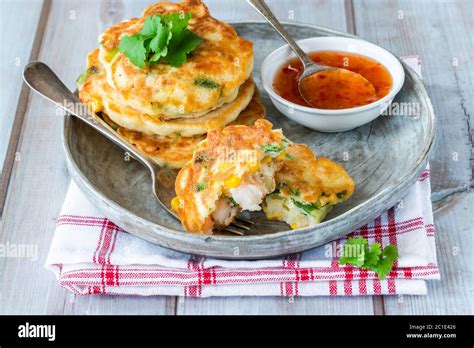 Prawn And Sweetcorn Fritters With Sweet Chilli Sauce Stock Photo Alamy