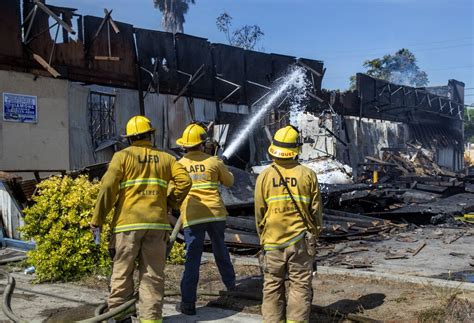 Two Firefighters Injured When Burning Building Collapses In South La