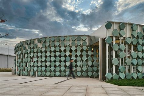 studio8 wraps a spiraling shanghai café with green porcelain tiles