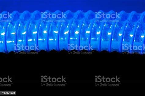 Abstract Of Two Industrial Conduits On A Black Background Stock Photo