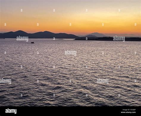 Athens sunset at sea Stock Photo - Alamy