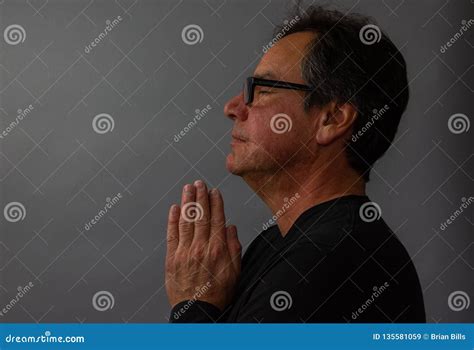 Mature Man Praying Contemplative With Hands On Prayer Pose Stock