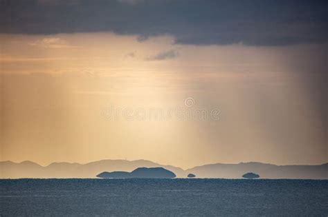 An Empty Calm Ocean With Mountain In The Background Stock Image Image