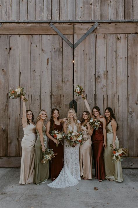 Bridesmaids Posing In Mismatched Fall Bridesmaid Dresses Green