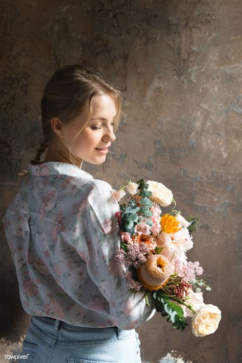 Download Premium Image Of Woman Holding A Bouquet Of Flowers 1207116