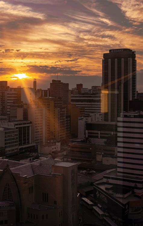 City Buildings During Sunset · Free Stock Photo