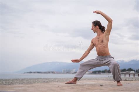 Caucasian Man With Naked Torso Practicing Wushu On The Seashore Stock Photo Image Of Nature