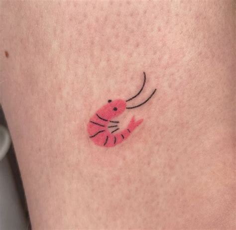 A Small Pink Crab Tattoo On The Leg