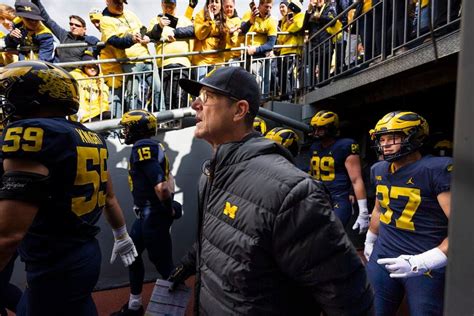 Football: Michigan’s Harbaugh off to the NFL ...Middle East