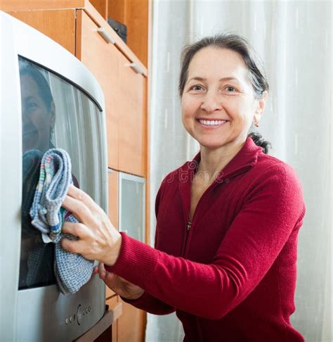 Mature Woman Dusting Tv Stock Photos Free Royalty Free Stock Photos